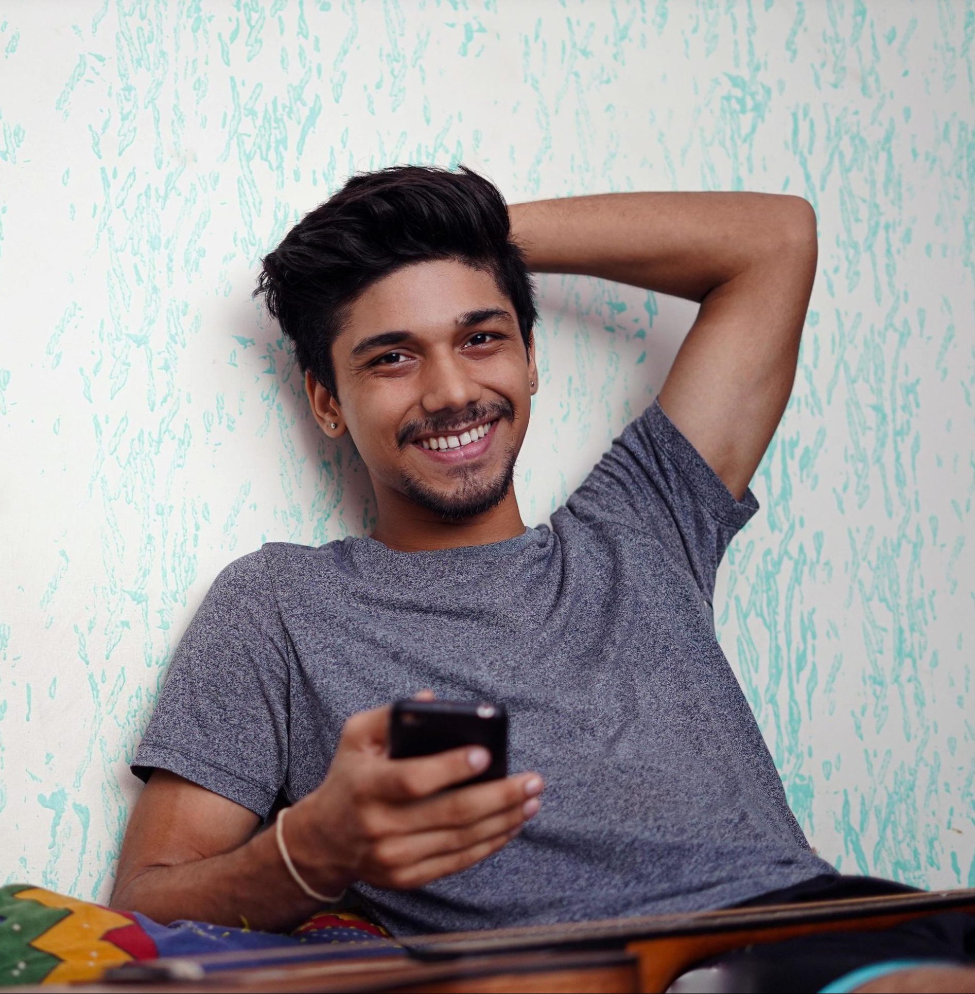 young-indian-boy-smiling-to-the-camera-free-photo